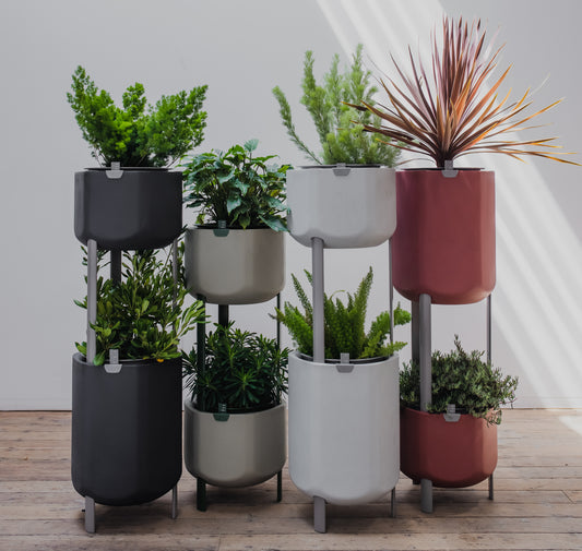 Stackable planters with green plants